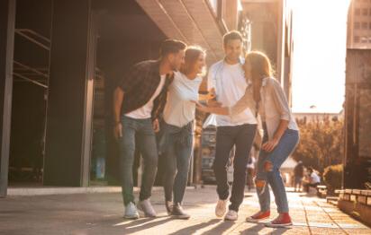 a group of friends chatting in a downtown area